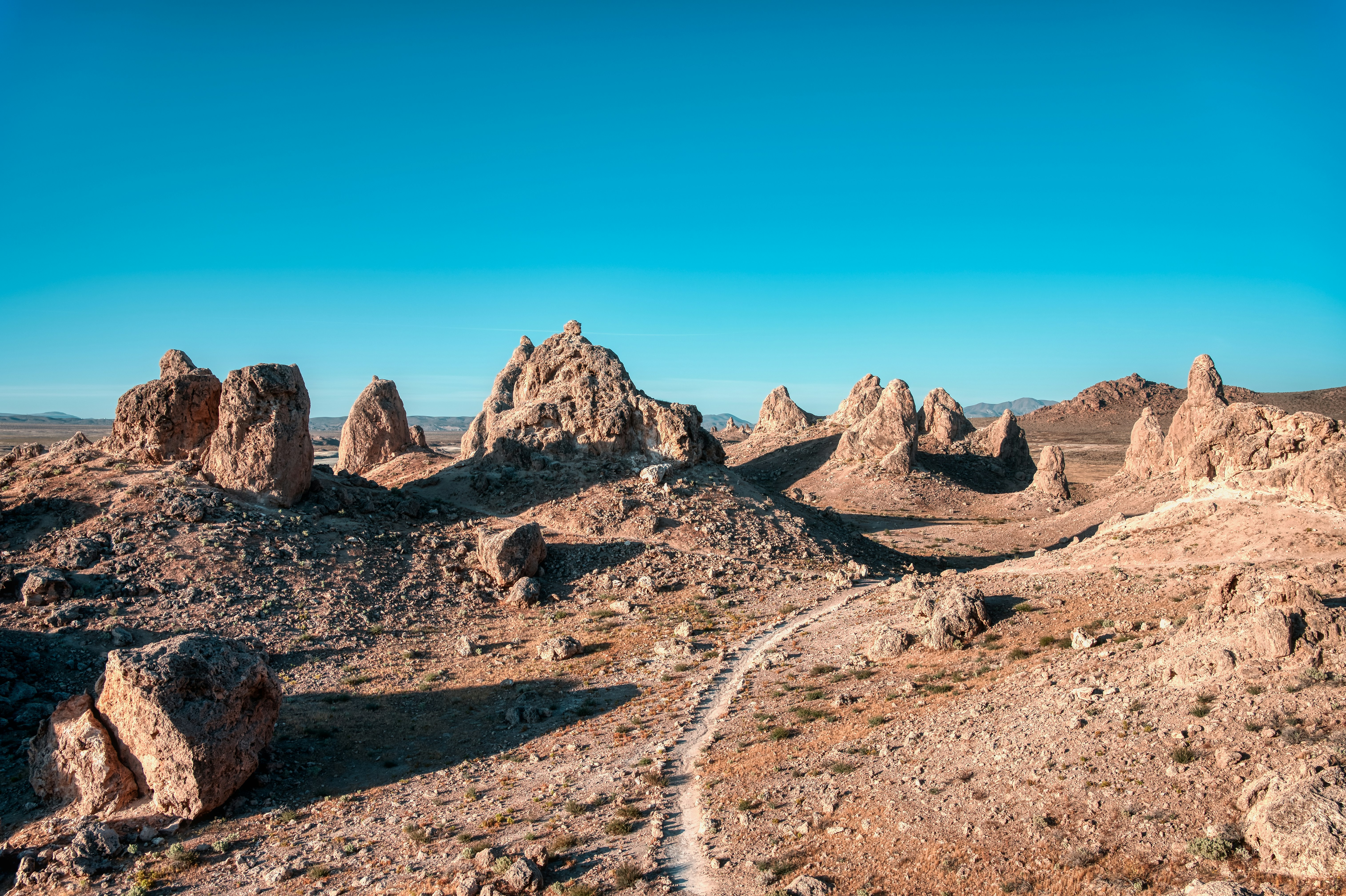 brown rocky mountain under blue sky during daytime